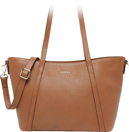 A zippered brown tote bag crafted from full grain leather with shoulder straps that extends across the entire bag as part of its design. There is a zipped back pocket, an interior zip pocket and two interior patch pockets for organization. It comes with a longer clip on strap for crossbody wear.